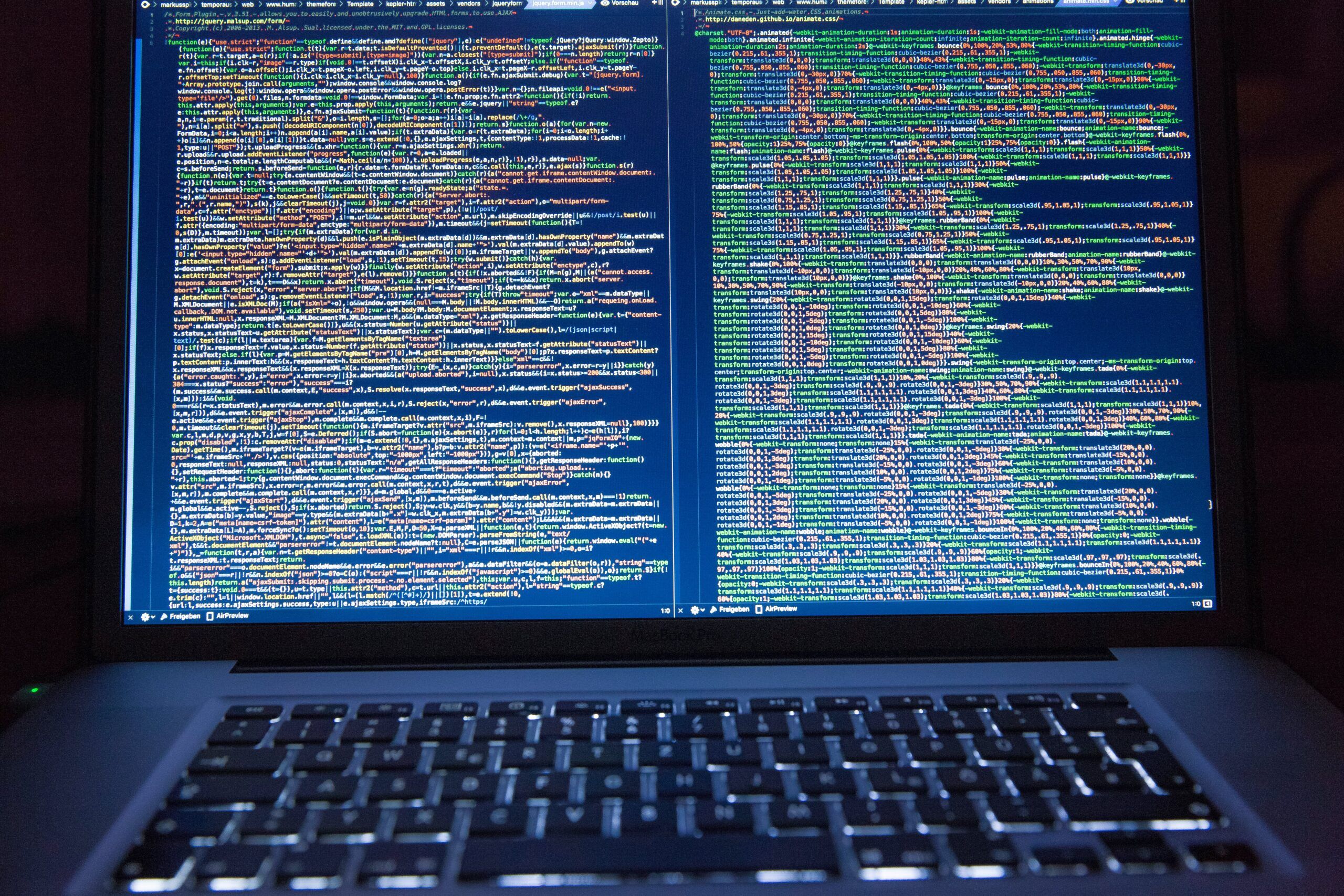 Computer with code on screen, LeadingIT, Cybersecurity